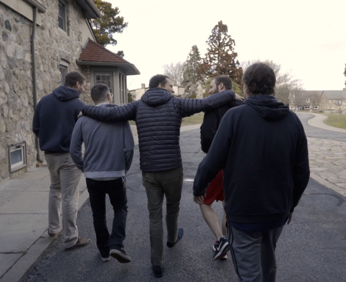 5 men walking